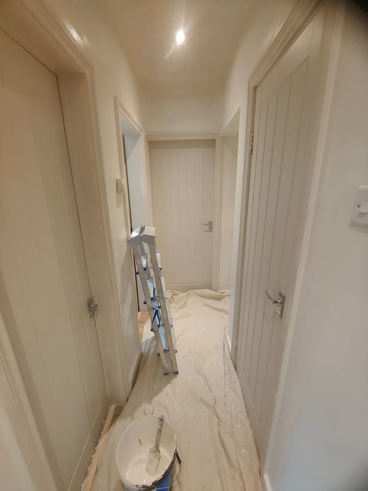 Hallway refreshed in Dulux Summer Linen with neatly finished woodwork